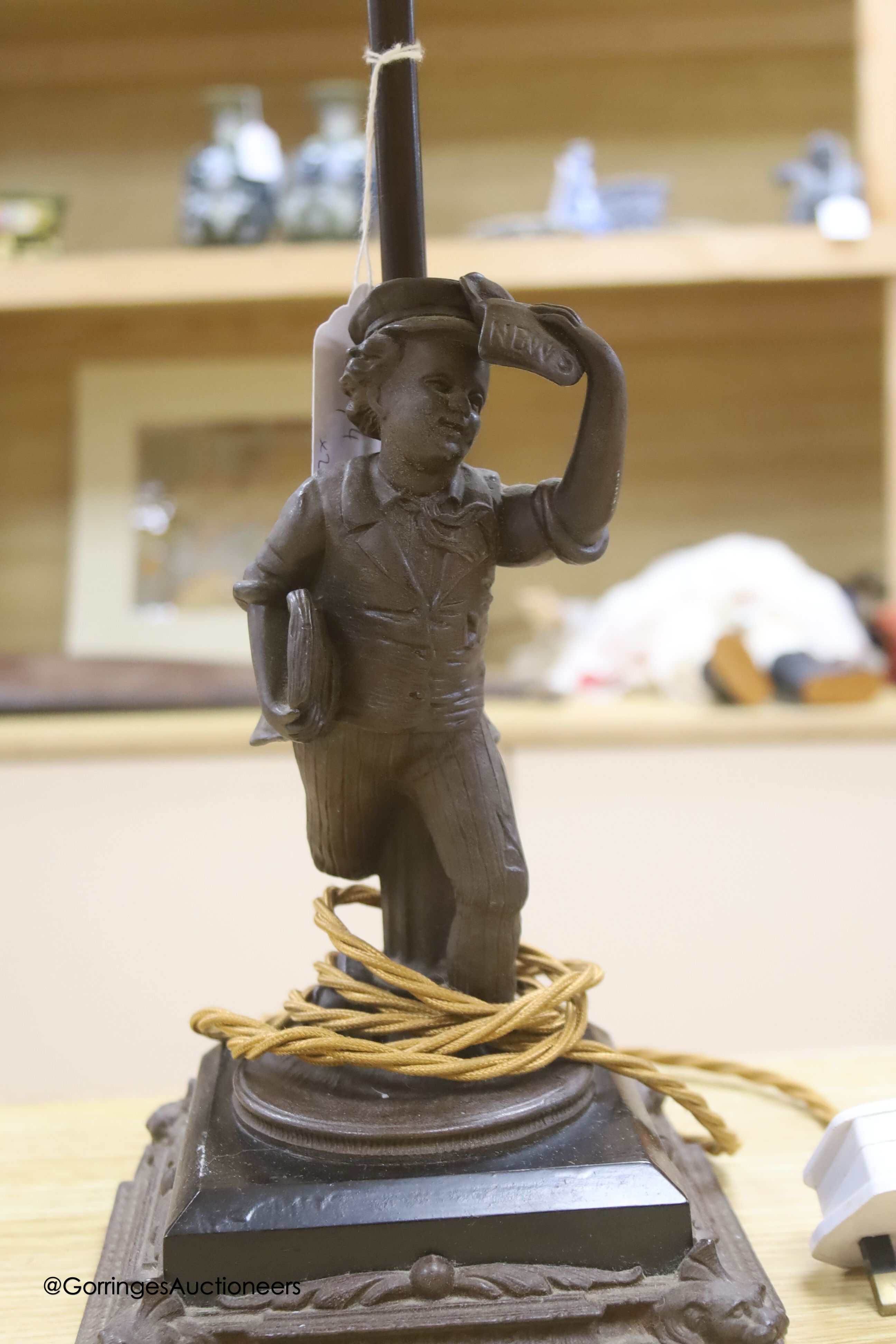 A spelter figural table lamp base and another lion student lamp, height 25cm (at base)